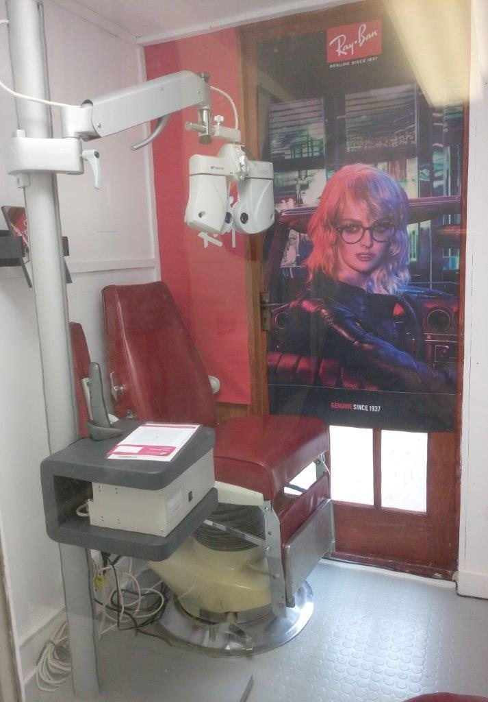 Our eyeBAR booth, an automatic phoropter the optometrist controls from the next room.